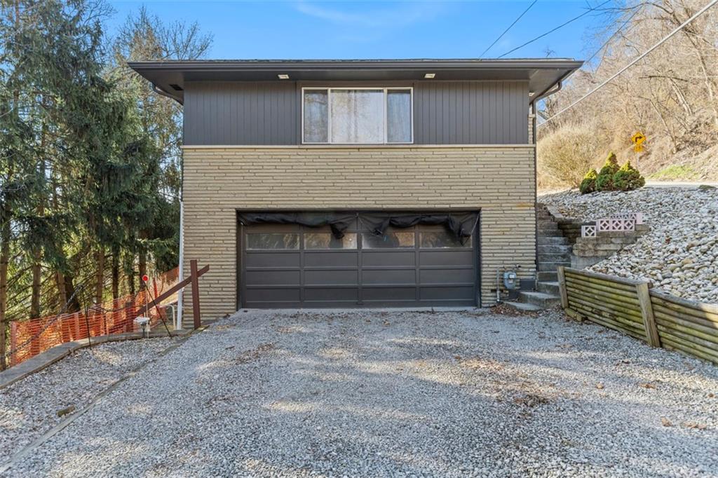 2219 Hill Road South Heights, PA 15081 - Photo 2 of 34 a front view of a house with garage