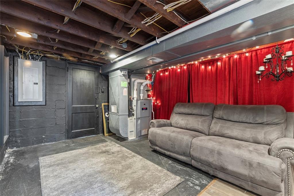 2219 Hill Road South Heights, PA 15081 - Photo 22 of 34 a living room with furniture and a chandelier