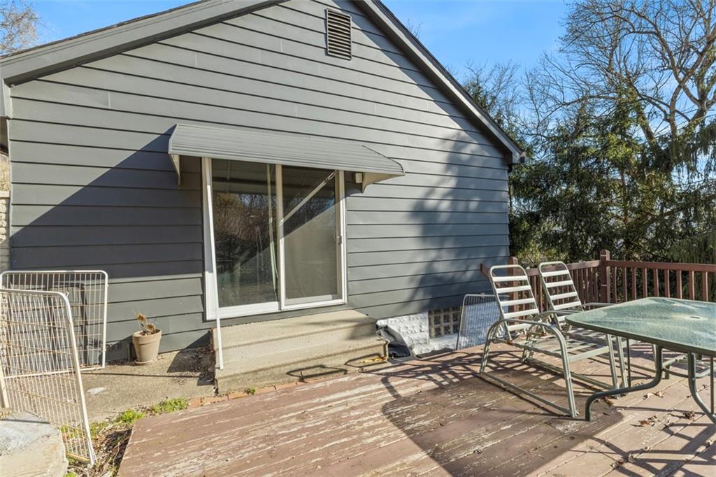 2219 Hill Road South Heights, PA 15081 - Photo 30 of 34 a view of a patio with table and chairs with wooden floor and fence