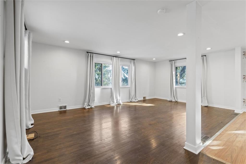 2219 Hill Road South Heights, PA 15081 - Photo 7 of 34 a view of an empty room with wooden floor and a window