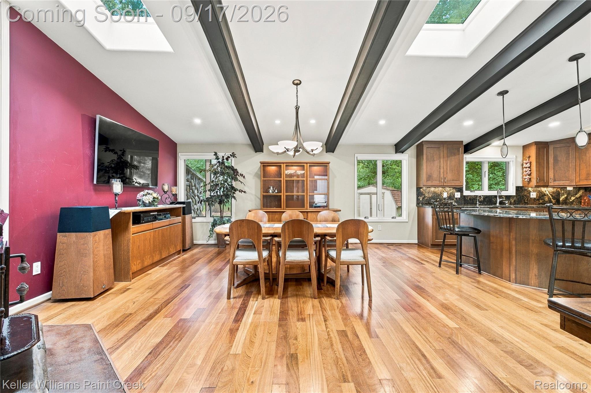 4535 Orion Road Rochester, MI 48306 - Photo 19 of 67 Hardwood flooring throughout, exposed ceiling beams, recessed lighting, skylights, and dark wood cabinetry with stone countertops