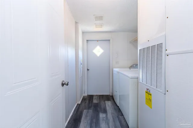 a view of hallway with wooden floor