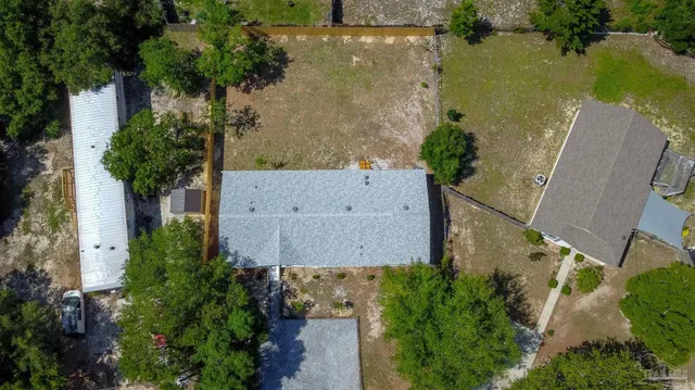 an aerial view of a houses with outdoor space