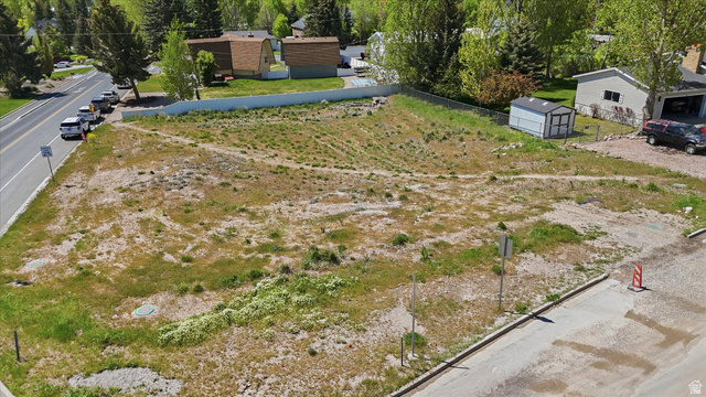 123 West 1050th North, Unit 41 Midway, UT 84049 - Photo 6 of 22 Expansive undeveloped lot featuring varied terrain and mature trees bordering the property