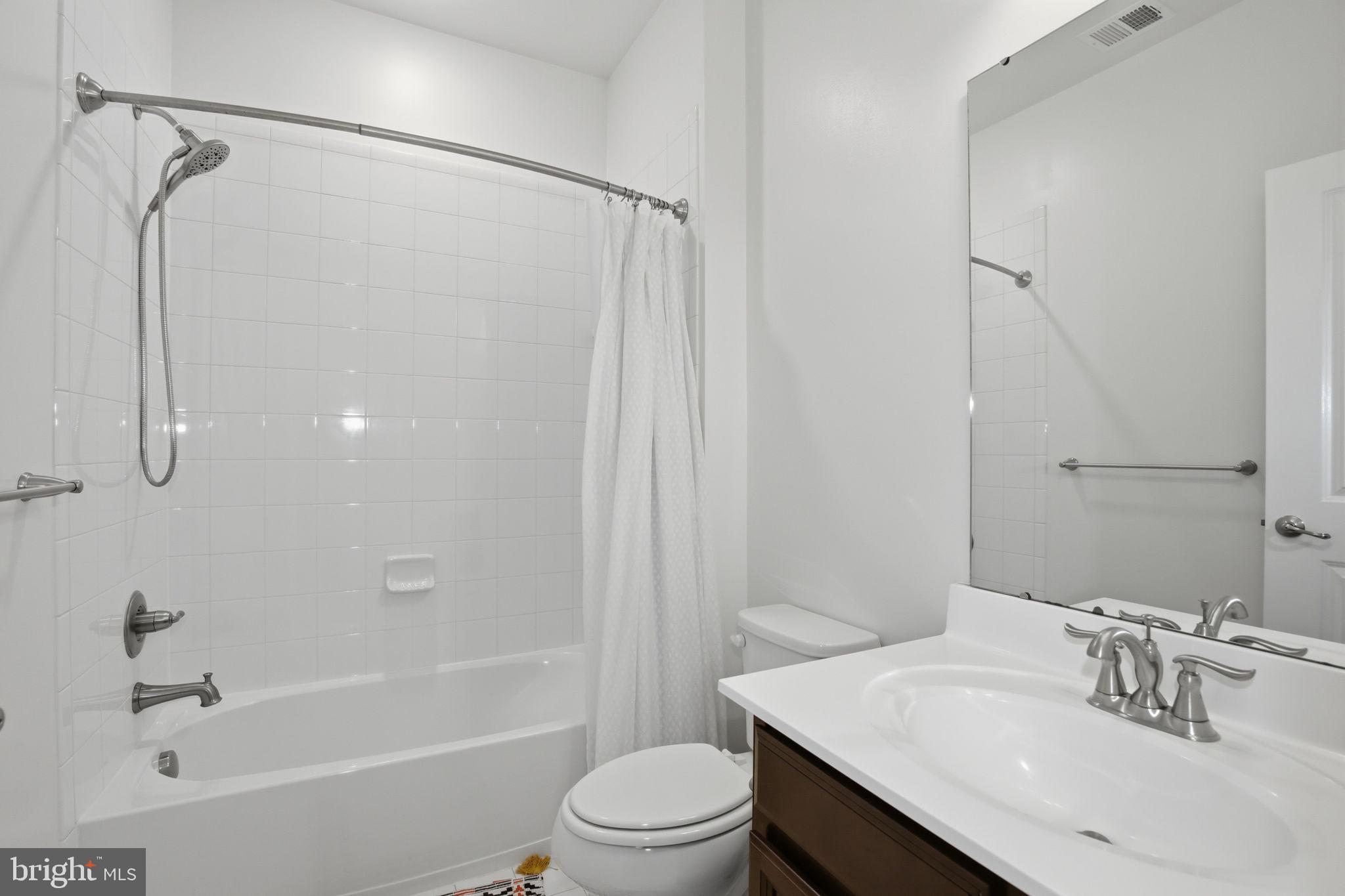 2784 Fredericksburg Road Hanover, MD 21076 - Photo 45 of 60 a bathroom with a sink toilet and shower