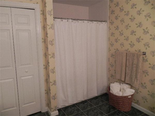 85 Culloden Drive Canton, MA 02021 - Photo 12 of 23 a bathroom with a toilet and a shower curtain