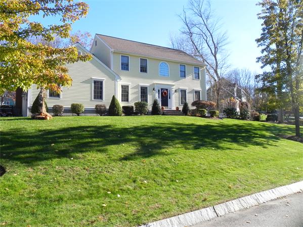 85 Culloden Drive Canton, MA 02021 - Photo 2 of 23 a view of a white house with a big yard and large trees