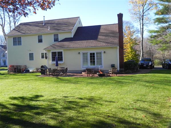 85 Culloden Drive Canton, MA 02021 - Photo 23 of 23 a backyard of a house with table and chairs