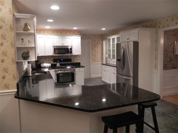85 Culloden Drive Canton, MA 02021 - Photo 4 of 23 a kitchen with stainless steel appliances granite countertop a sink a refrigerator and a stove