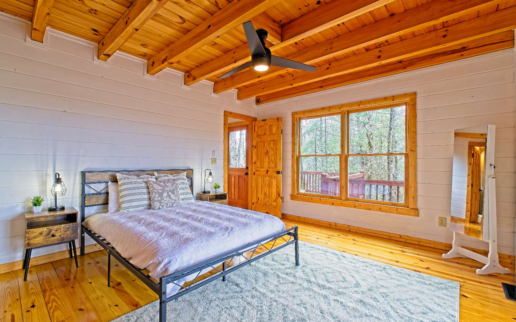 360 Tall Timber Mountain Road Blue Ridge, GA 30513 - Photo 18 of 52 a bedroom with a bed and wooden floor