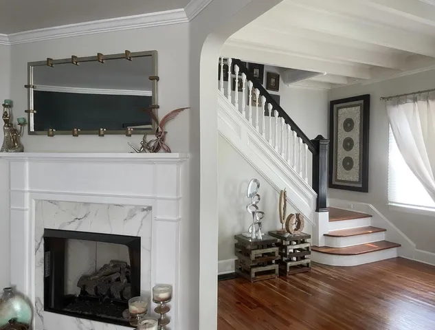 a living room with furniture and a fireplace