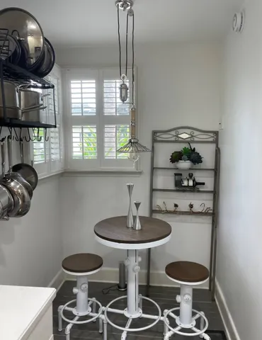 a kitchen with a stove and a table