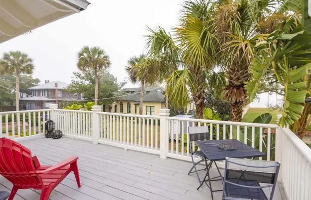 a view of a chair and table on the deck