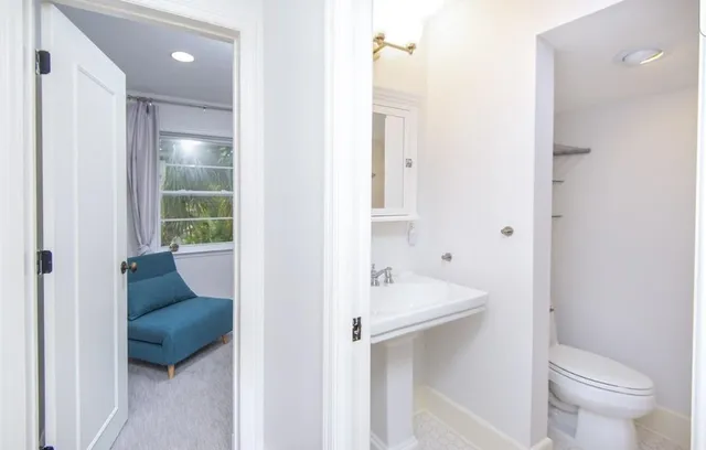 a en suite bathroom with a sink and a mirror