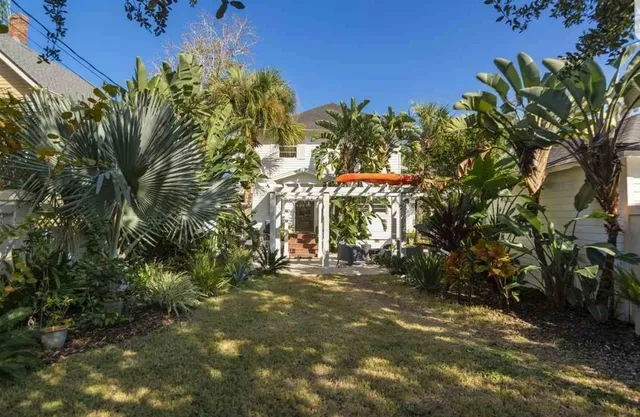 a backyard of a house with lots of green space