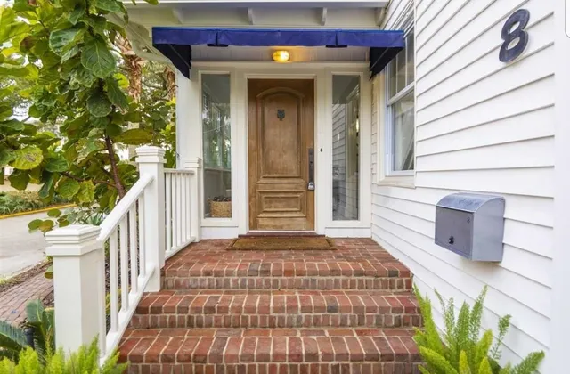 a front view of a house with a porch