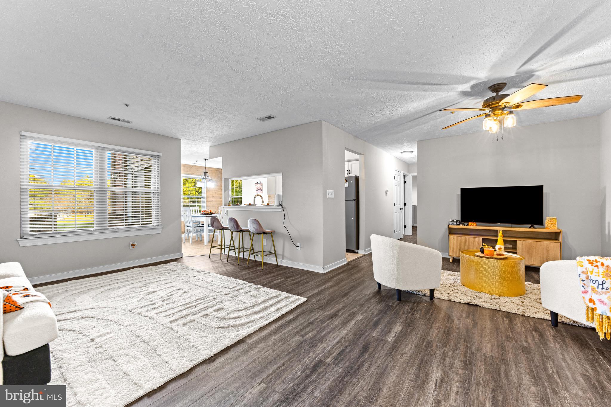 1713 Landmark Drive, Unit 1L Forest Hill, MD 21050 - Photo 1 of 28 a living room with furniture and a flat screen tv