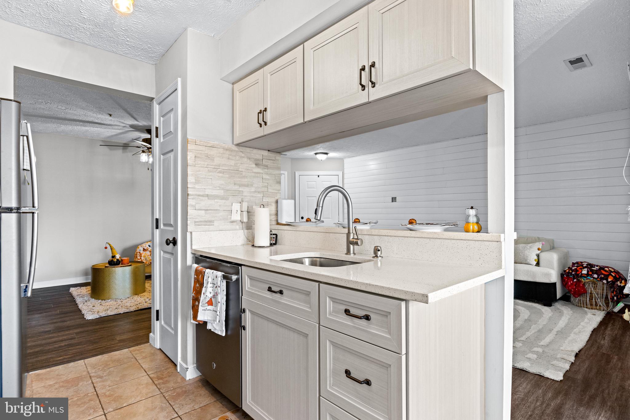 1713 Landmark Drive, Unit 1L Forest Hill, MD 21050 - Photo 12 of 28 a kitchen with a sink and cabinets