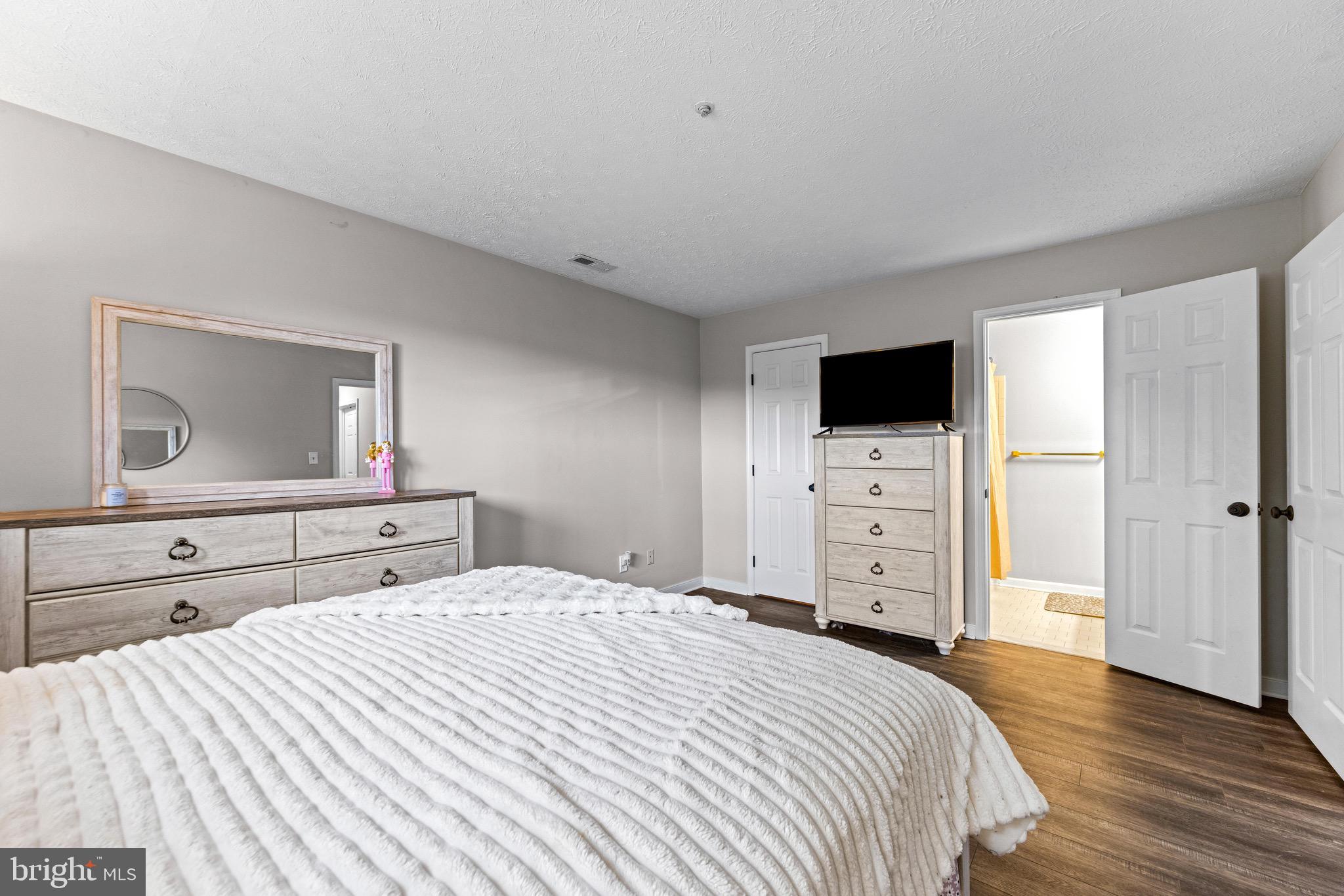 1713 Landmark Drive, Unit 1L Forest Hill, MD 21050 - Photo 17 of 28 a bedroom with a bed and a television