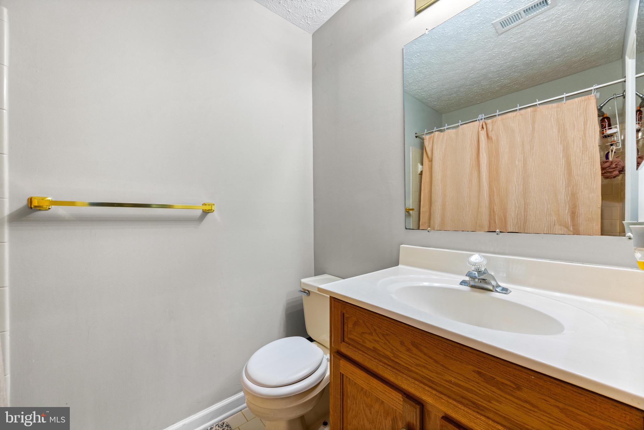 1713 Landmark Drive, Unit 1L Forest Hill, MD 21050 - Photo 18 of 28 a bathroom with a sink and a toilet