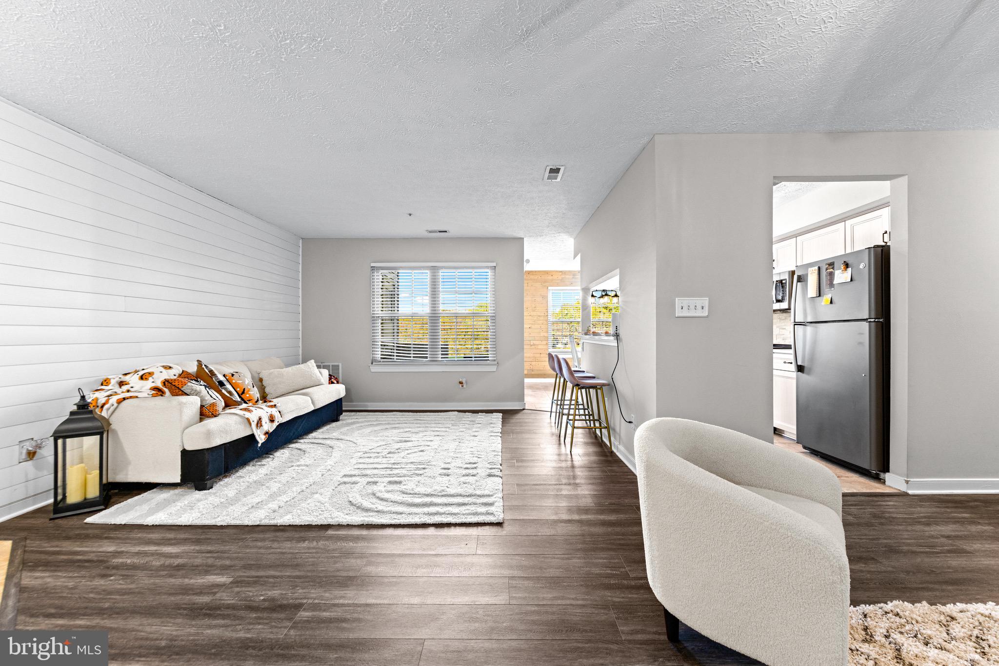 1713 Landmark Drive, Unit 1L Forest Hill, MD 21050 - Photo 4 of 28 a living room with furniture and a wooden floor
