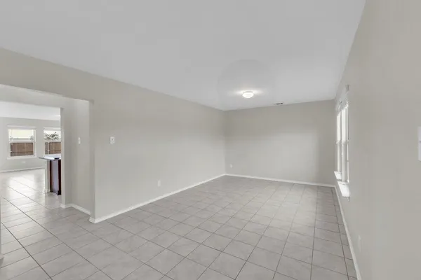 a view of staircase with white walls and windows