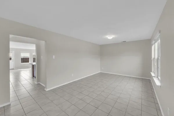 a kitchen with granite countertop a sink and cabinets