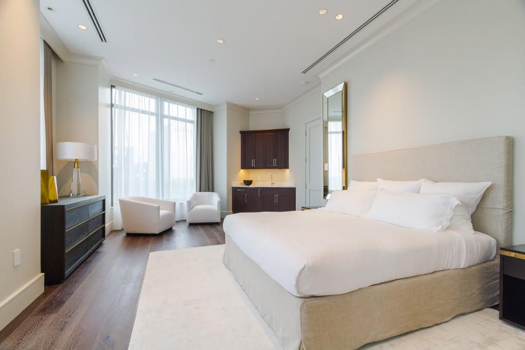 3376 Peachtree Road Northeast, Unit 33A Atlanta, GA 30326 - Photo 14 of 49 a bedroom with a large bed and a couch