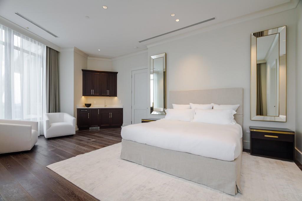 3376 Peachtree Road Northeast, Unit 33A Atlanta, GA 30326 - Photo 15 of 49 a bedroom with a bed couch and windows