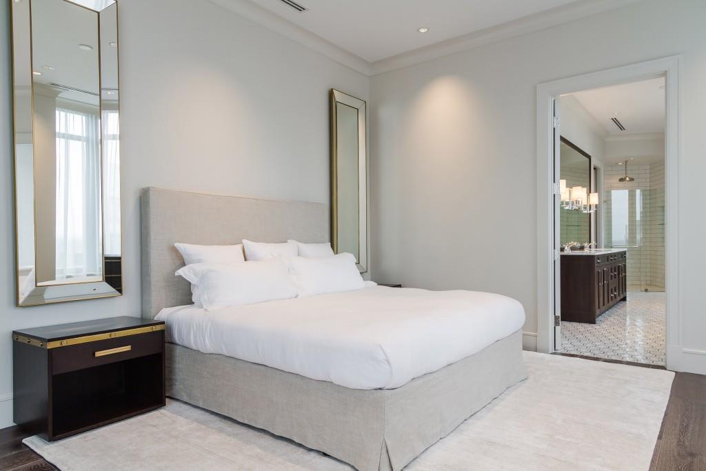 3376 Peachtree Road Northeast, Unit 33A Atlanta, GA 30326 - Photo 16 of 49 a bedroom with a bed and a lamp