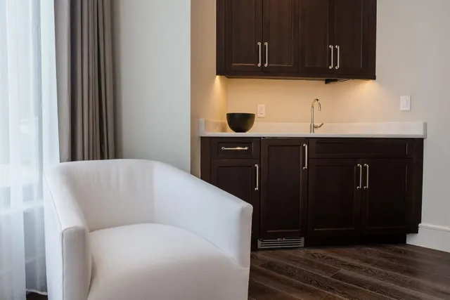 a kitchen with a cabinets and wooden floor