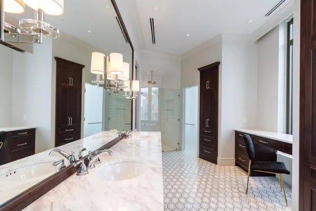 a bathroom with a tub sink and mirror