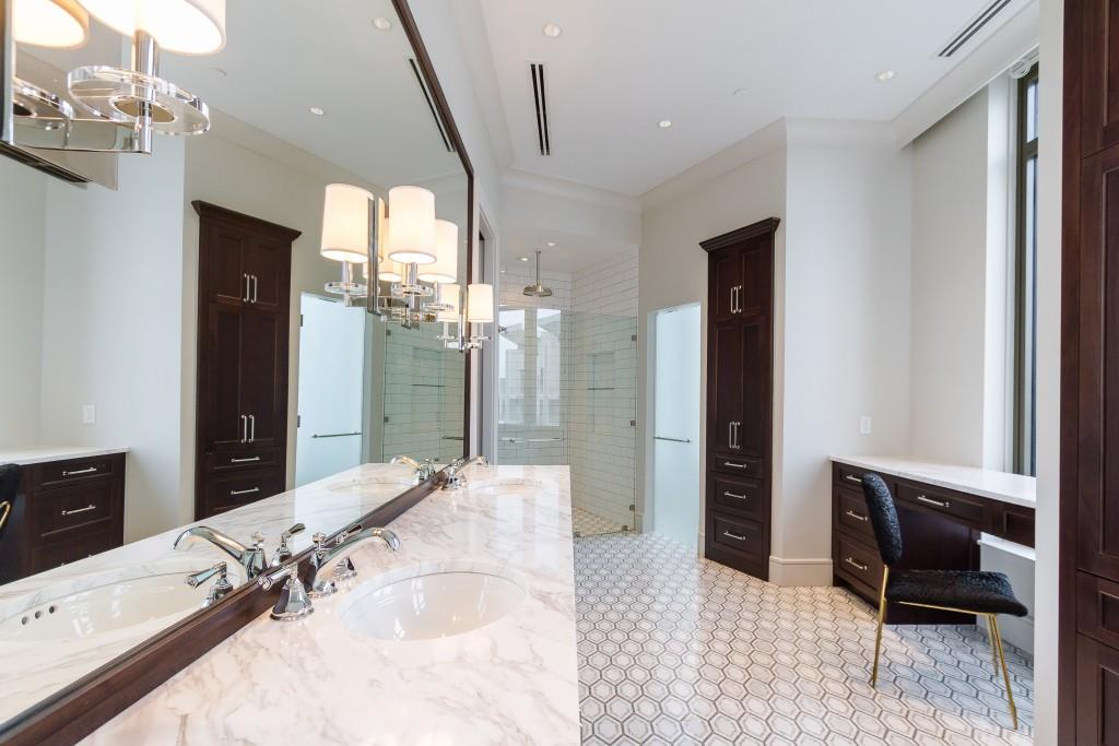 3376 Peachtree Road Northeast, Unit 33A Atlanta, GA 30326 - Photo 19 of 49 a bathroom with a tub sink and mirror