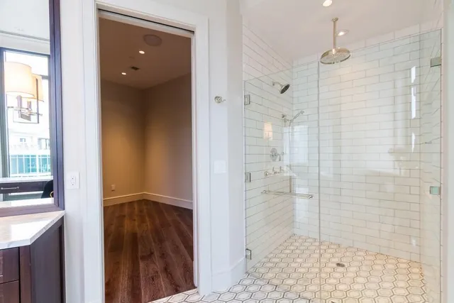 a bathroom with a shower and a sink