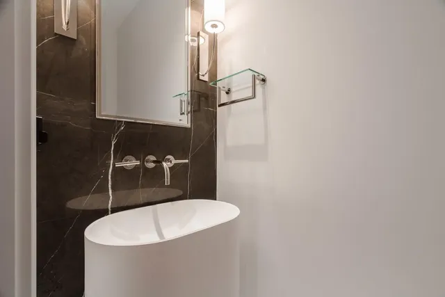 a bathroom with a sink and mirror