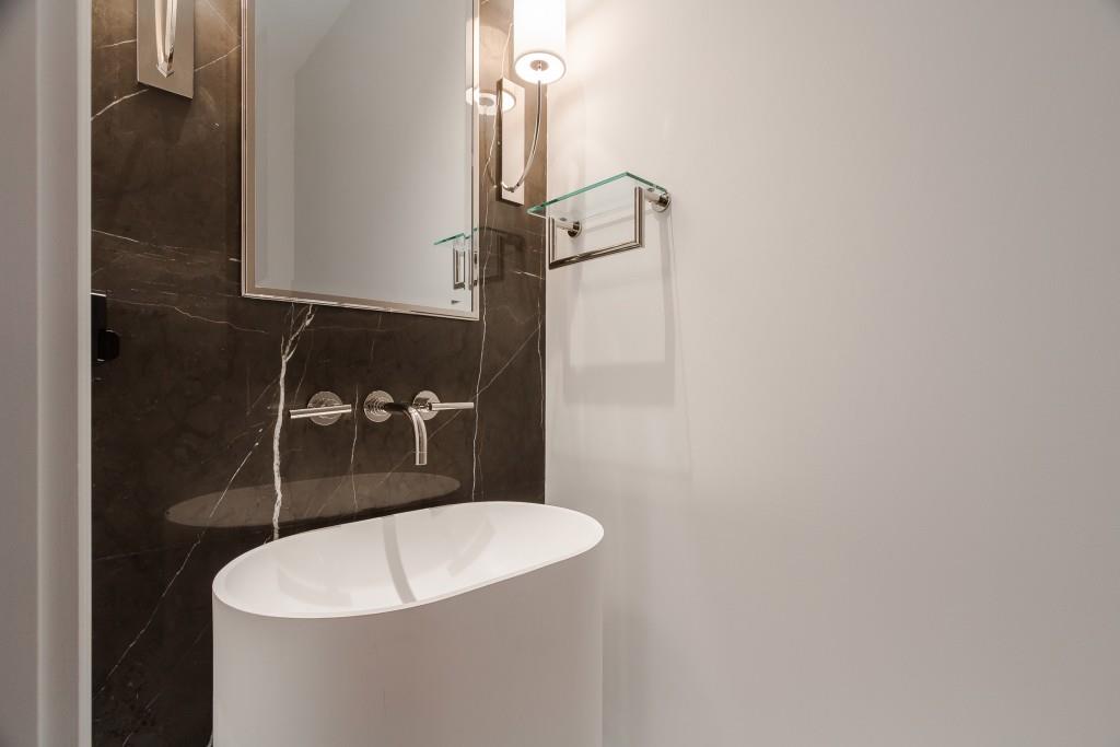 3376 Peachtree Road Northeast, Unit 33A Atlanta, GA 30326 - Photo 22 of 49 a bathroom with a sink and mirror