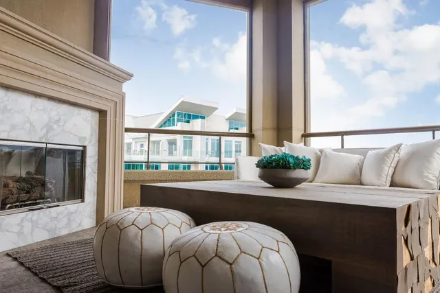 a living room with a bed furniture and a fireplace