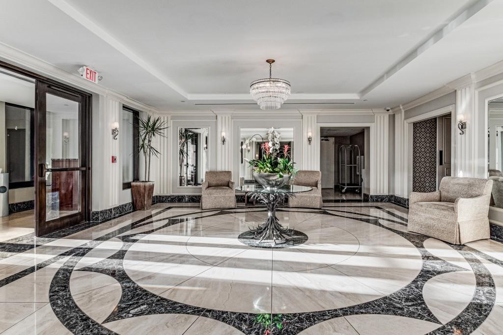 3376 Peachtree Road Northeast, Unit 33A Atlanta, GA 30326 - Photo 39 of 49 a dining room with wooden floor and chandelier