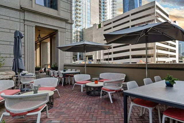 a couple of chairs sitting in front of a building