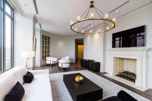 a living room with furniture a dining table and chairs