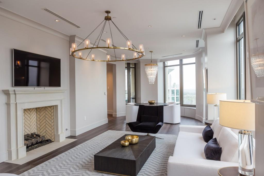 3376 Peachtree Road Northeast, Unit 33A Atlanta, GA 30326 - Photo 10 of 49 a living room with furniture and a fireplace