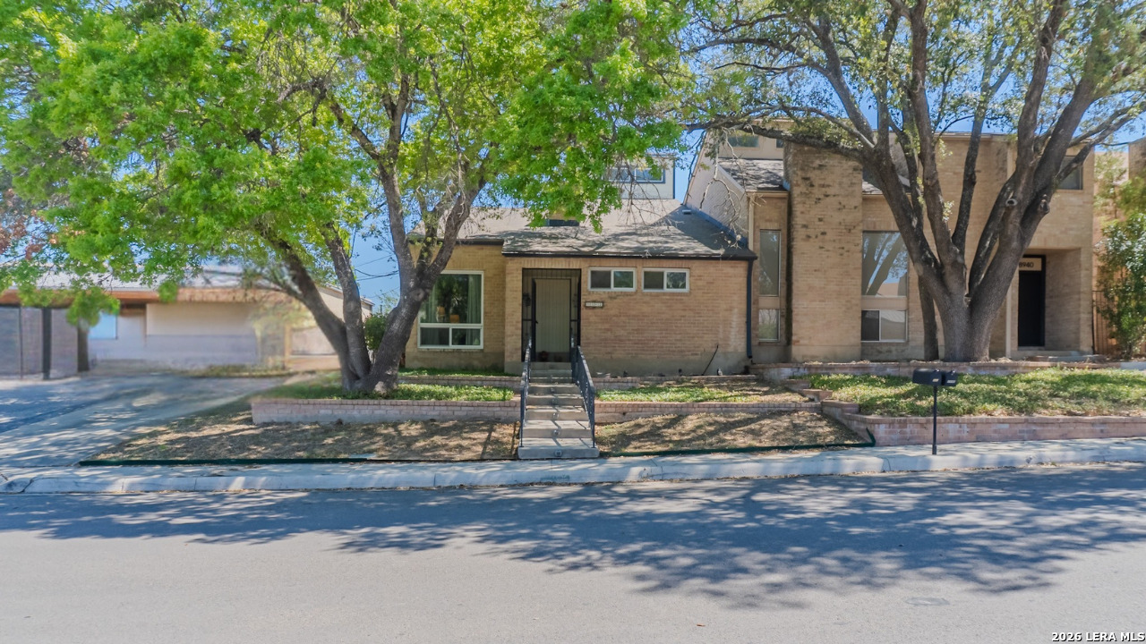 a view of a house with tree s