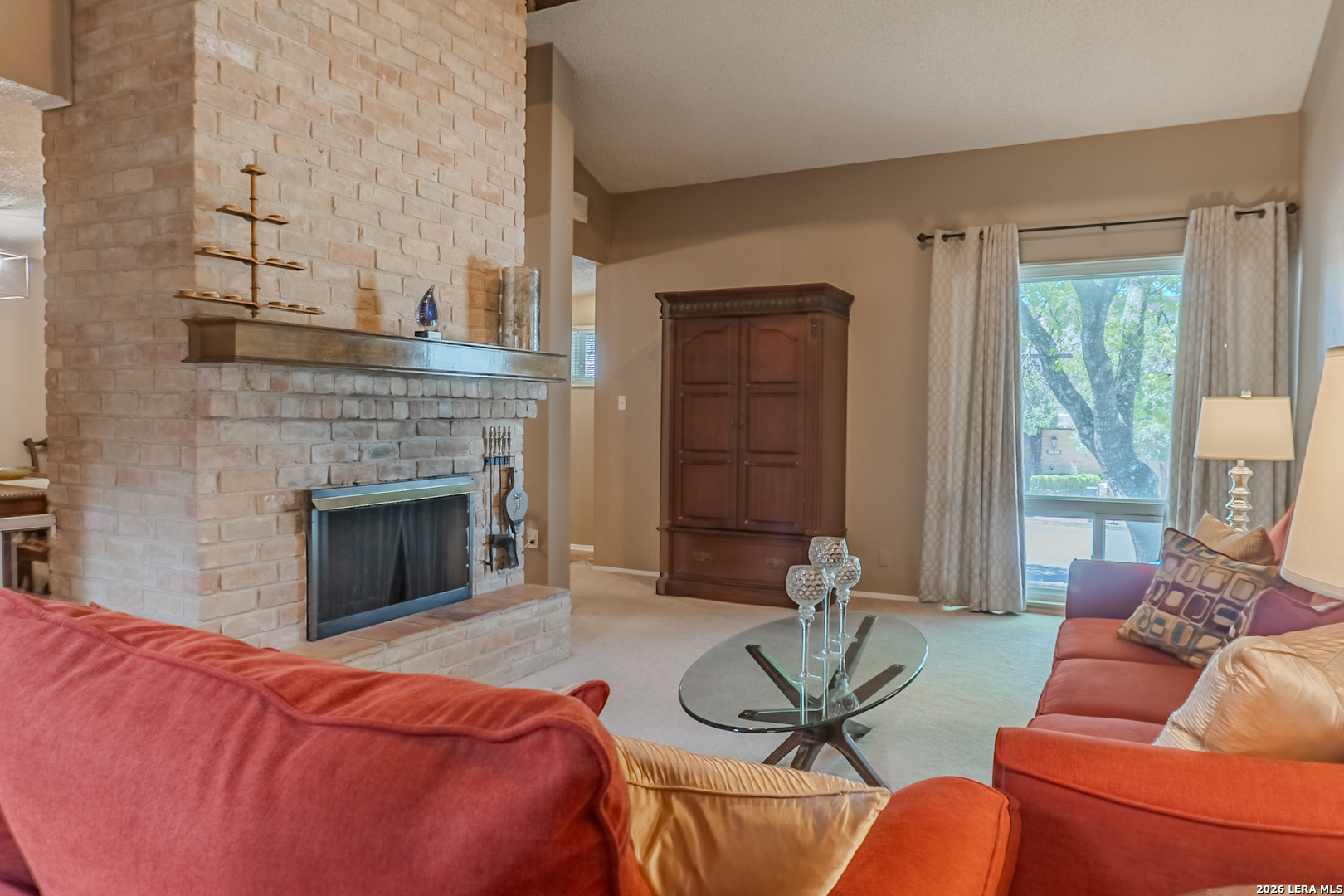 8942 Willmon Way Windcrest, TX 78239 - Photo 13 of 44 a living room with furniture and a fireplace
