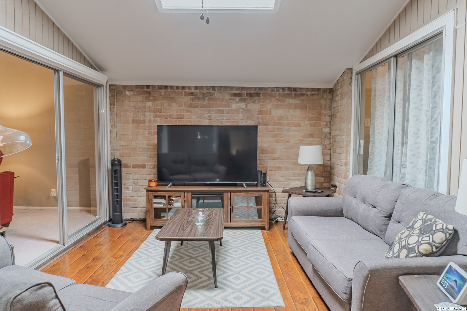 8942 Willmon Way Windcrest, TX 78239 - Photo 15 of 44 a living room with furniture and a flat screen tv