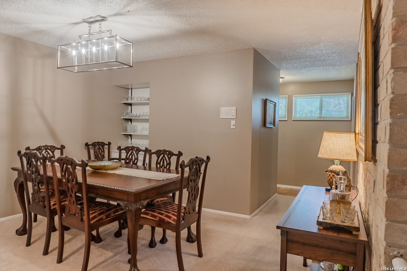 8942 Willmon Way Windcrest, TX 78239 - Photo 16 of 44 a view of a dining room with furniture and chandelier