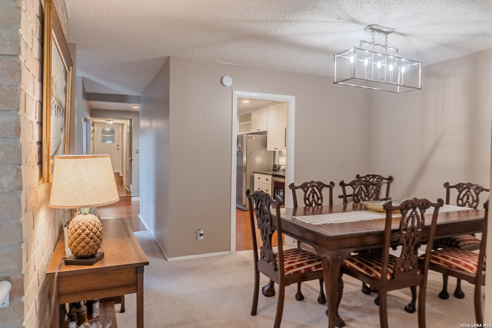 8942 Willmon Way Windcrest, TX 78239 - Photo 19 of 44 a view of a dining room with furniture and chandelier