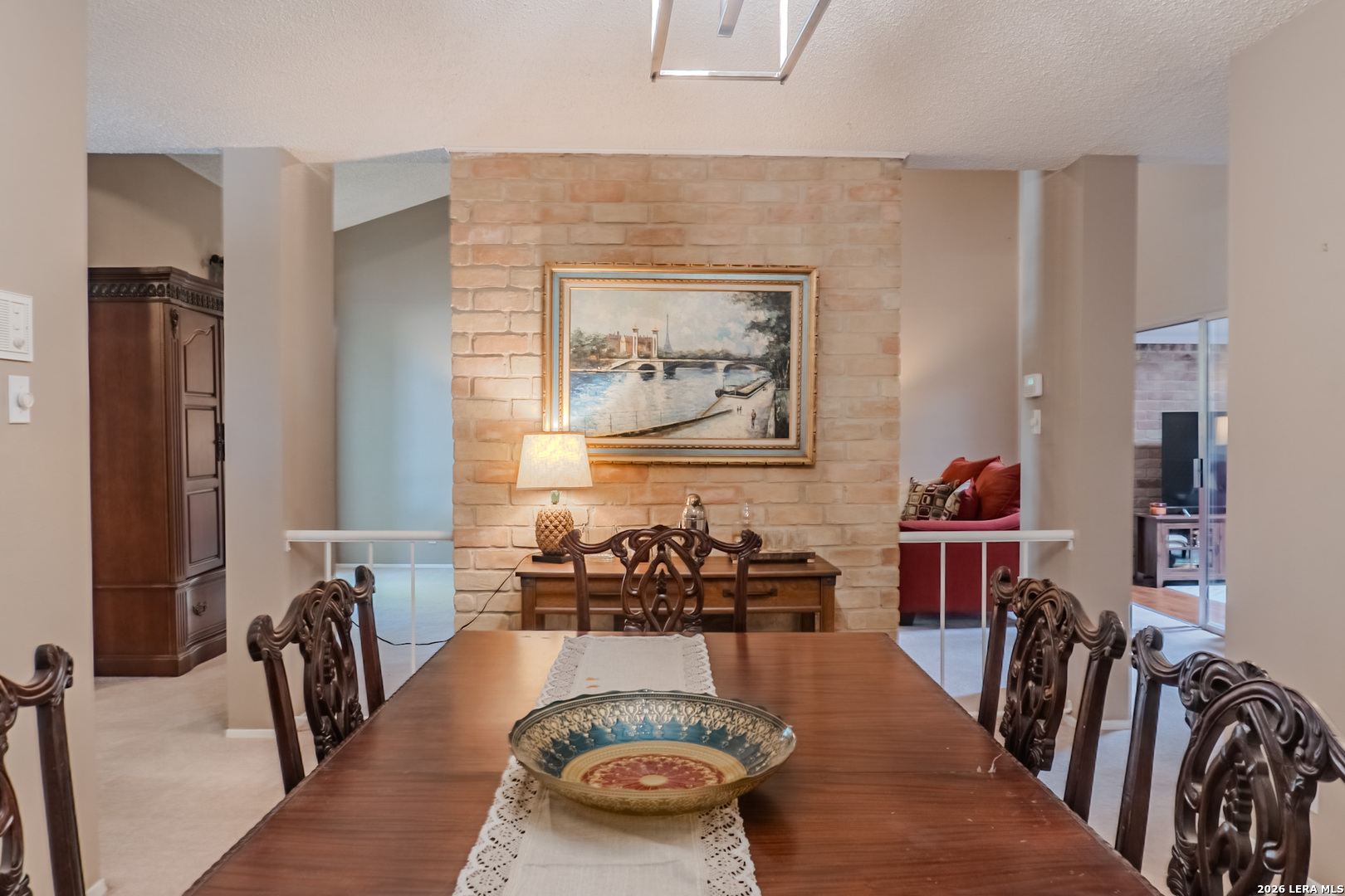 8942 Willmon Way Windcrest, TX 78239 - Photo 20 of 44 a dining room with furniture and a painting