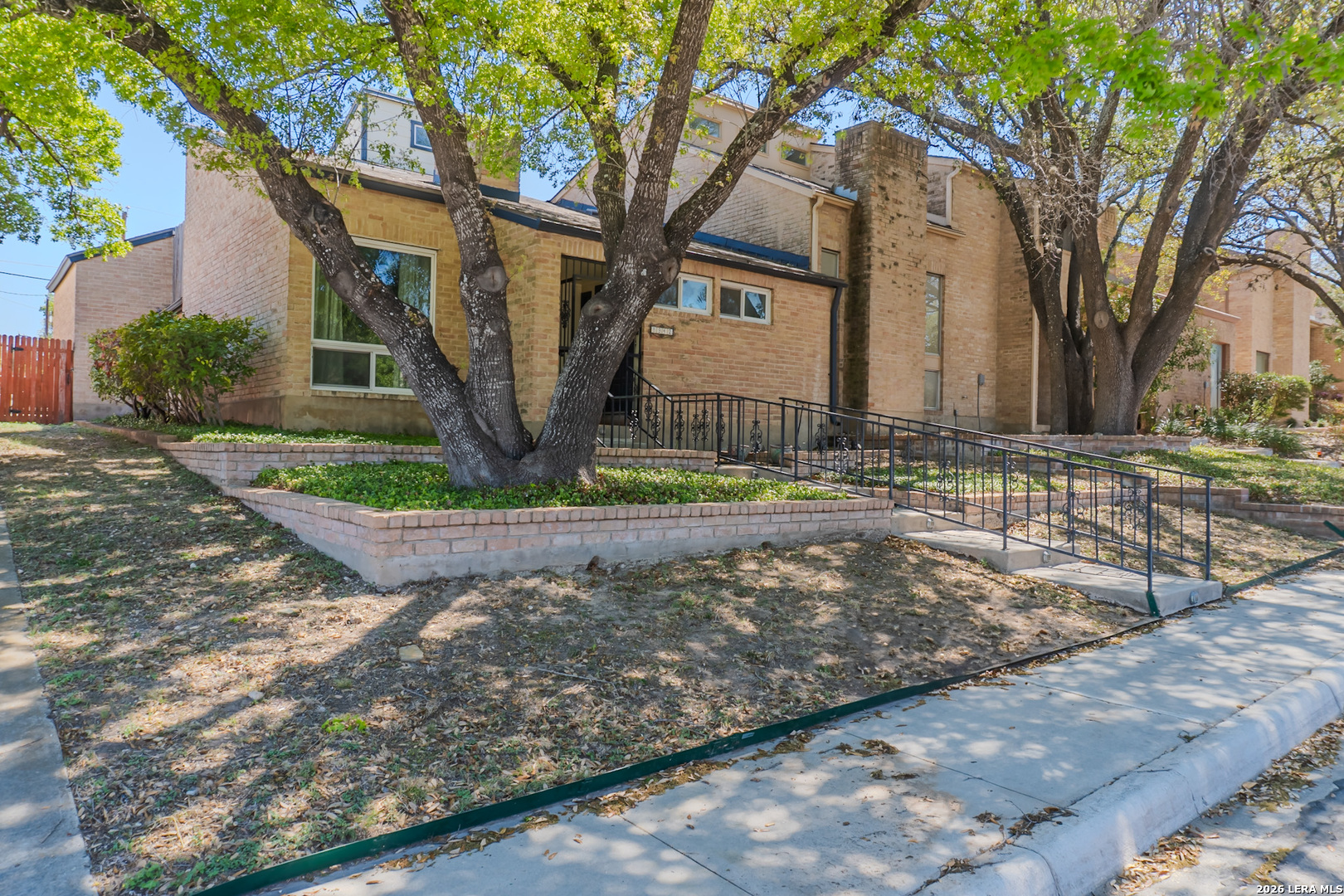8942 Willmon Way Windcrest, TX 78239 - Photo 2 of 44 a view of a house with a yard