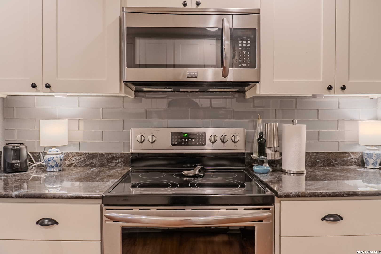 8942 Willmon Way Windcrest, TX 78239 - Photo 24 of 44 a stove top oven sitting inside of a kitchen