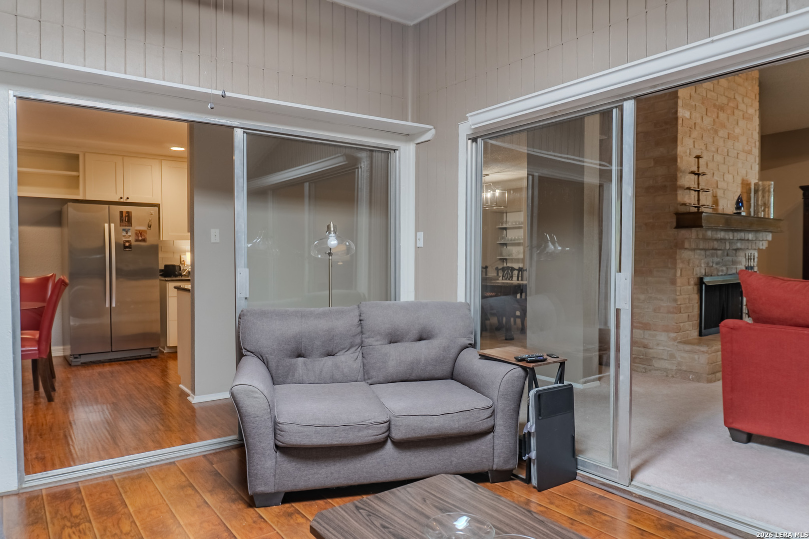8942 Willmon Way Windcrest, TX 78239 - Photo 26 of 44 a living room with furniture and a glass door
